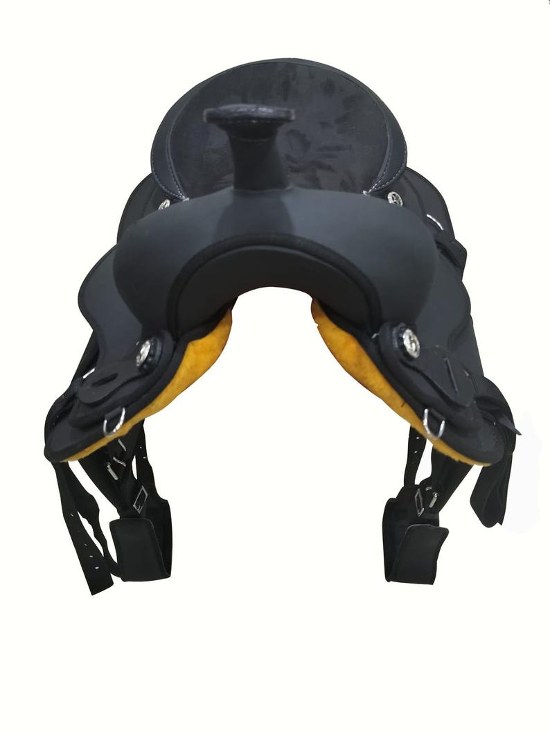 May include: A black Western saddle with a textured seat and yellow padding. The saddle features silver-toned hardware and adjustable straps. The design is suitable for equestrian activities and horse riding.