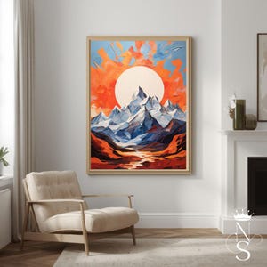 May include: A framed landscape painting depicts a mountain range under a large sun. The mountains are blue and white, the sun is white, and the sky is orange and blue. The painting is in a wooden frame and hangs on a white wall.