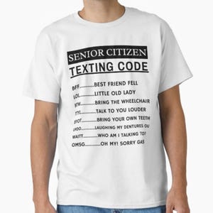 May include: White t-shirt with the text "SENIOR CITIZEN TEXTING CODE" in a black rectangular box. Below the text are common texting abbreviations and their meanings, such as "BFF...BEST FRIEND FELL" and "LOL...LITTLE OLD LADY".