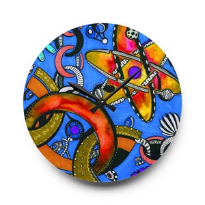 May include: Round wall clock with a vibrant abstract design. The clock face features a blue background with orange, yellow, and black geometric shapes. Black clock hands indicate the time. A unique piece of home decor.