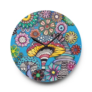 May include: Round wall clock with a vibrant, hand-drawn design featuring colorful mushrooms and flowers against a bright blue background. The clock hands are black, and the overall style is whimsical and artistic.