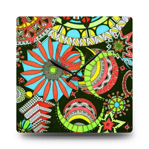 May include: Square wall clock with a black background and a colorful, abstract floral design. The clock face features a large blue and orange flower, along with other shapes in red, yellow, and green. Black clock hands indicate the time.