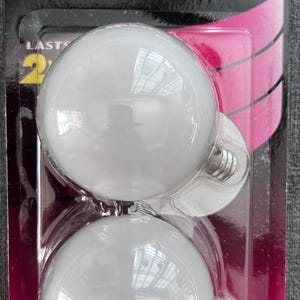 May include: Package of two Philips DuraMax decorative globe light bulbs. Each bulb is white, 60w, and has a candelabra base. The packaging indicates the bulbs last for 2 years and emit 450 lumens.