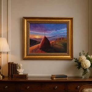 May include: A framed oil painting depicting a rural landscape at sunset with a large haystack in the foreground, rolling hills, a wooden fence, and a vibrant purple and orange sky, all enclosed within an ornate, textured gold-coloured frame.