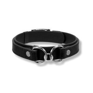 May include: A black leather bracelet with two silver-colored rings in the center. The bracelet has a buckle closure and silver-colored rivets. The design is simple and elegant, suitable for everyday wear.