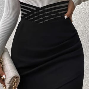 Fashionable Versatile Cross Hollow Asymmetric Hem Skirt.