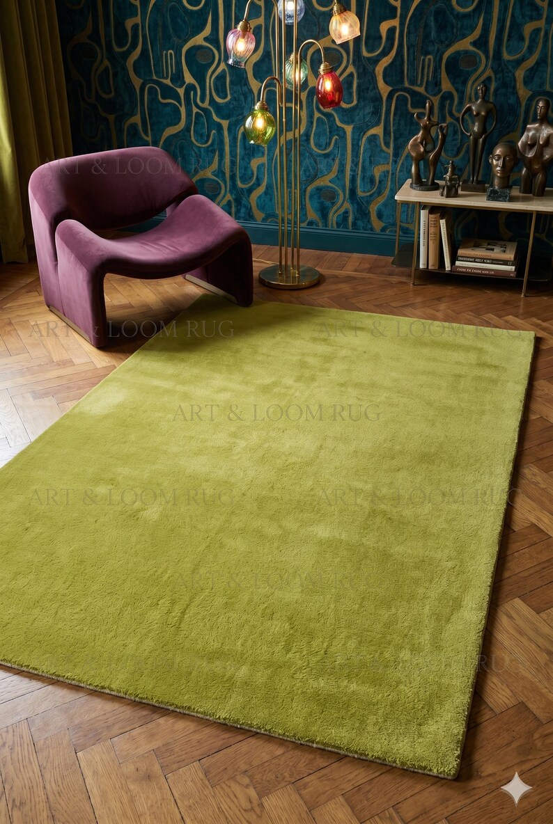 May include: A large, rectangular, lime green rug with a plush texture. The rug is placed on a hardwood floor, with a purple chair and a multi-colored glass lamp in the background. The rug is a key element in the room's decor.