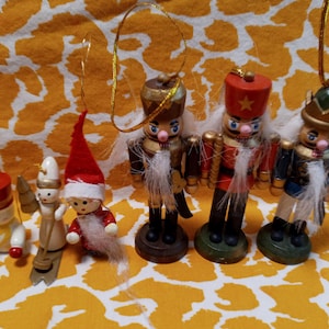 Vintage misc lot of tiny Nutcrackers and other holiday themed wooden ornaments