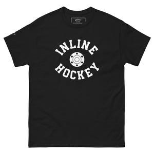 May include: Black t-shirt with the words "INLINE HOCKEY" in white, arched above and below a graphic of an inline skate wheel. The shirt has a crew neck and short sleeves. The brand name "HOCKEY" is printed on the tag.
