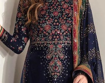 May include: A navy blue embroidered dress with a matching shawl and small handbag. The dress features intricate floral patterns in red, green, and gold. The shawl has a striped border with similar colors.