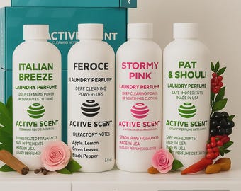 May include: Four white laundry perfume bottles with different scents, including "Italian Breeze" and "Stormy Pink", are displayed with a washing machine. The bottles are labeled "Active Scent". Decorative elements include flowers and berries.