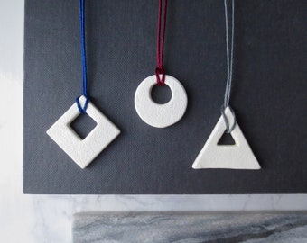 Lith - Silver White Clay Geometry Necklace; Negative Space Sculpture Square Triangle Circle Pendant; Red Blue Grey Bamboo Cord by InfinEight