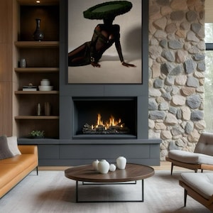 May include: A modern living room with a large framed artwork above a fireplace. The artwork features a person wearing a green hat. The room includes a brown leather sofa, a round coffee table, and two armchairs.