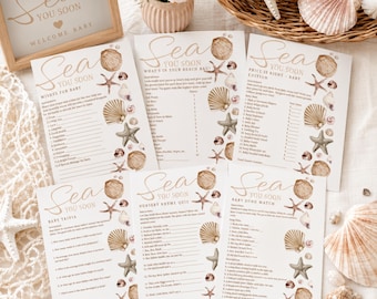 May include: A set of five white baby shower game cards with the text Sea You Soon, featuring illustrations of seashells and starfish in tan and brown tones. The cards include titles like Wishes for Baby, What's in Your Beach Bag, and Baby Trivia.