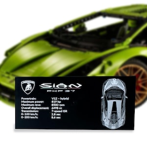 May include: A lime green Lamborghini Sian FKP 37 model car with a black display plaque. The plaque features the Lamborghini logo, the text Sian FKP 37, and technical specifications including V12-hybrid powertrain, 819 hp, and 6498 cc displacement.