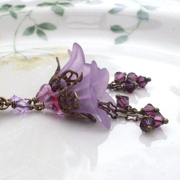 Mauve lucite lily earrings with Swarovski crystal dangles and antiqued brass. E246a-v