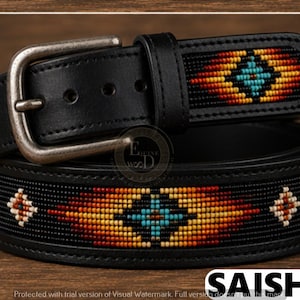 May include: A black leather belt featuring a silver-toned metal buckle and a beaded inlay. The beadwork displays a geometric pattern in shades of orange, yellow, red, and turquoise against a black background. The belt has a series of adjustment holes.