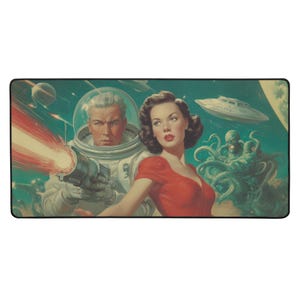 May include: A rectangular mousepad featuring a retro sci-fi illustration. An astronaut in a spacesuit fires a ray gun, with a woman in a red dress and a green alien in the background. The scene includes a flying saucer and planets.