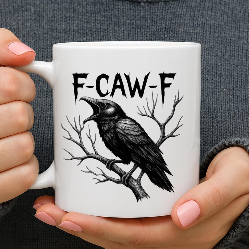 May include: White ceramic mug featuring a black illustration of a crow perched on a branch, with the text "F-CAW-F" in a gothic font. The crow is depicted with its beak open. A unique gift for bird lovers.