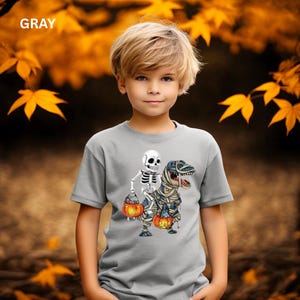 Kids Skeleton Mummy Dinosaur Halloween Shirt, Maroon Youth Tee with DTF Print, Trick or Treat Pumpkin T-Rex Costume Shirt for Boys & Girls