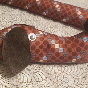 Dachshund draft stopper; draught excluder; Dog light blocker; cotton fabric in brown with teal dots ; pre filled