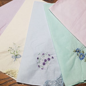 50 pieces lovely pastel colored handkerchiefs with embroidery and lace on one corner; cotton; soft colors; assorted colors and designs
