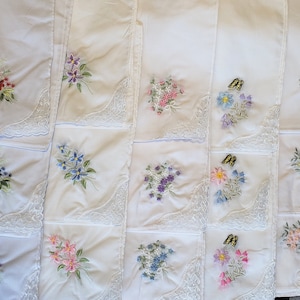 50 pieces lovely white handkerchiefs with embroidery and lace on one corner; cotton; soft colors; assorted colors and designs