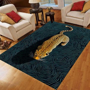May include: A rectangular area rug featuring a leopard design. The rug has a dark blue background with a swirling pattern in light blue. The leopard is depicted in shades of brown and yellow.