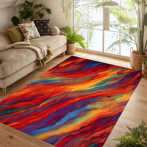 May include: A rectangular area rug with a vibrant abstract design. The rug features a flowing pattern of red, orange, yellow, blue, and purple hues, creating a dynamic and colorful visual effect. The rug is placed on a wooden floor.