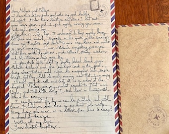May include: A handwritten letter on airmail stationery with red, white, and blue borders. The letter is addressed to "Mother and Father" and includes a postmark and a matching envelope.