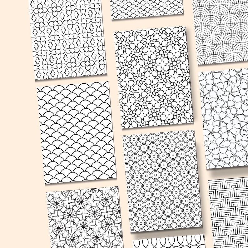 May include: A collection of black and white patterned designs, each on a rectangular card. The patterns include floral, geometric, and abstract shapes. The cards are arranged on a light beige background, showcasing the variety of designs.