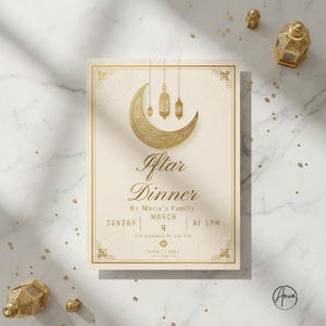 May include: Ivory-colored invitation with gold accents for an Iftar Dinner. The design features a crescent moon and hanging lanterns, with elegant script text. Details include the date, time, and RSVP information.