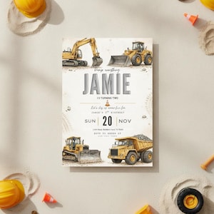 May include: A rectangular birthday invitation card featuring watercolor illustrations of yellow construction vehicles including an excavator, a bulldozer, and a dump truck. The text reads JAMIE IS TURNING TWO, Let's dig up some fun for JAMIE'S 2ND BIRTHDAY, SUN 20 NOV.