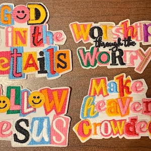 May include: Embroidered patches with colorful text, including phrases like "God is in the details," "Worship through the worry," and "Make heaven crowded." Each patch features a unique font and design, with smiley faces.