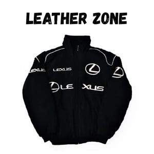 May include: Black jacket with white accents and the text "LEATHER ZONE" at the top. The jacket features the Lexus logo and text in white. A sporty, zip-up jacket.