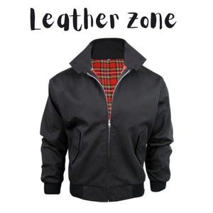 May include: Black jacket with a red and black plaid lining, a zipper closure, and two front pockets. The jacket has a collar and ribbed cuffs and hem. The text "Leather Zone" is above the jacket.