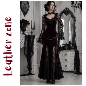 May include: A floor-length dark burgundy velvet dress featuring long bell sleeves with black lace trim, a high lace neckline, and two vertical lace-paneled slits at the front of the skirt. The text "Leather zone" is printed vertically in red.