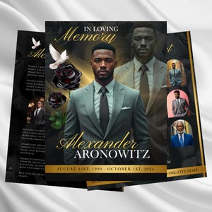 May include: A memorial card featuring a portrait of a man in a gray suit, with the text "In Loving Memory" and the name "Alexander Aronowitz." The card includes dates and decorative elements.