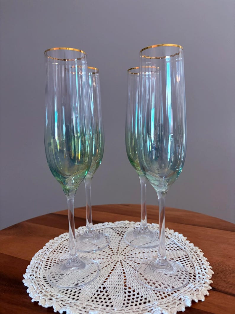 May include: A set of three ceramic mugs with a speckled, matte finish. The mugs are in shades of cream, light gray, and dark gray. Each mug has a simple, minimalist design, perfect for coffee or tea.