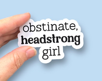 May include: White sticker with black text that reads "obstinate, headstrong girl".