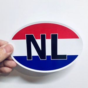 May include: Oval sticker with the letters "NL" in black on a red, white, and blue background, resembling the Dutch flag.