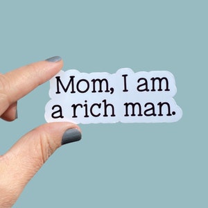May include: White sticker with black text that reads "Mom, I am a rich man."