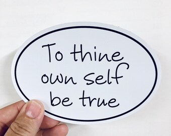 May include: White oval sticker with black text that reads "To thine own self be true."
