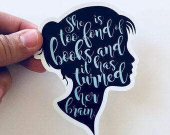 May include: A black silhouette of a person's head with the text "She is too fond of books and it has turned her brain." in light blue lettering.