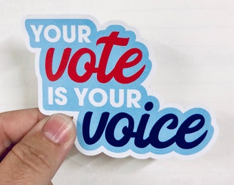May include: A blue and white sticker with the text "Your vote is your voice" in red and blue lettering.