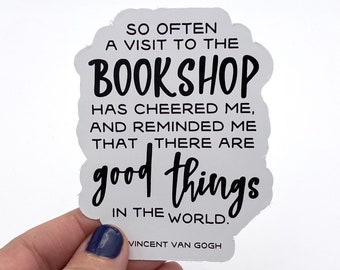 May include: White sticker with black text that reads "So often a visit to the bookshop has cheered me, and reminded me that there are good things in the world."  The text is in a handwritten font.  The sticker also includes the text "Vincent Van Gogh" in a smaller font.