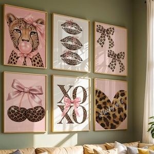 May include: A set of six framed wall art prints featuring a cheetah with a pink bow and bubblegum, three leopard print lips, two leopard print bows, two cherries with a pink bow, the text XOXO with a pink bow, and a leopard print heart with Lucky girl.