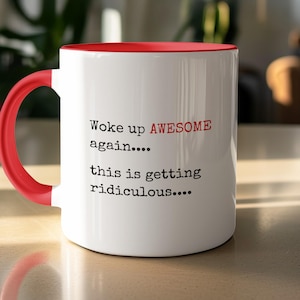 May include: A white ceramic mug with a bright red handle and interior. The exterior features black typewriter-style text that reads: Woke up AWESOME again.... this is getting ridiculous.... with the word AWESOME printed in bold red letters.