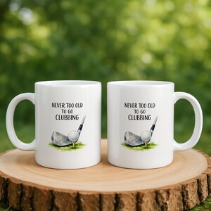 Two mugs with "Never too old to go clubbing" text and golf imagery.