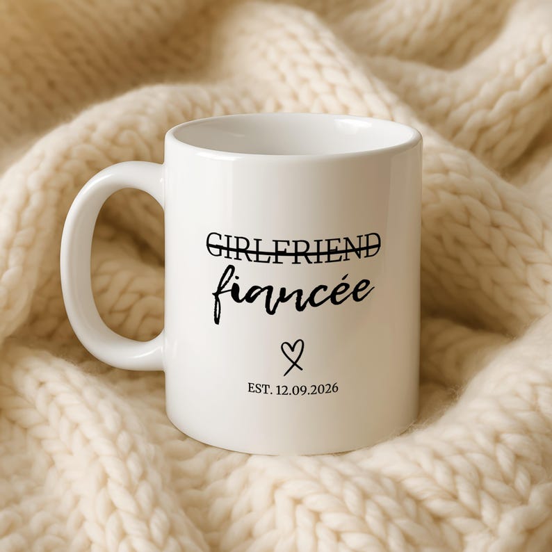 White mug with "Girlfriend fiancée" and "Est. 12.09.2026" text on it.